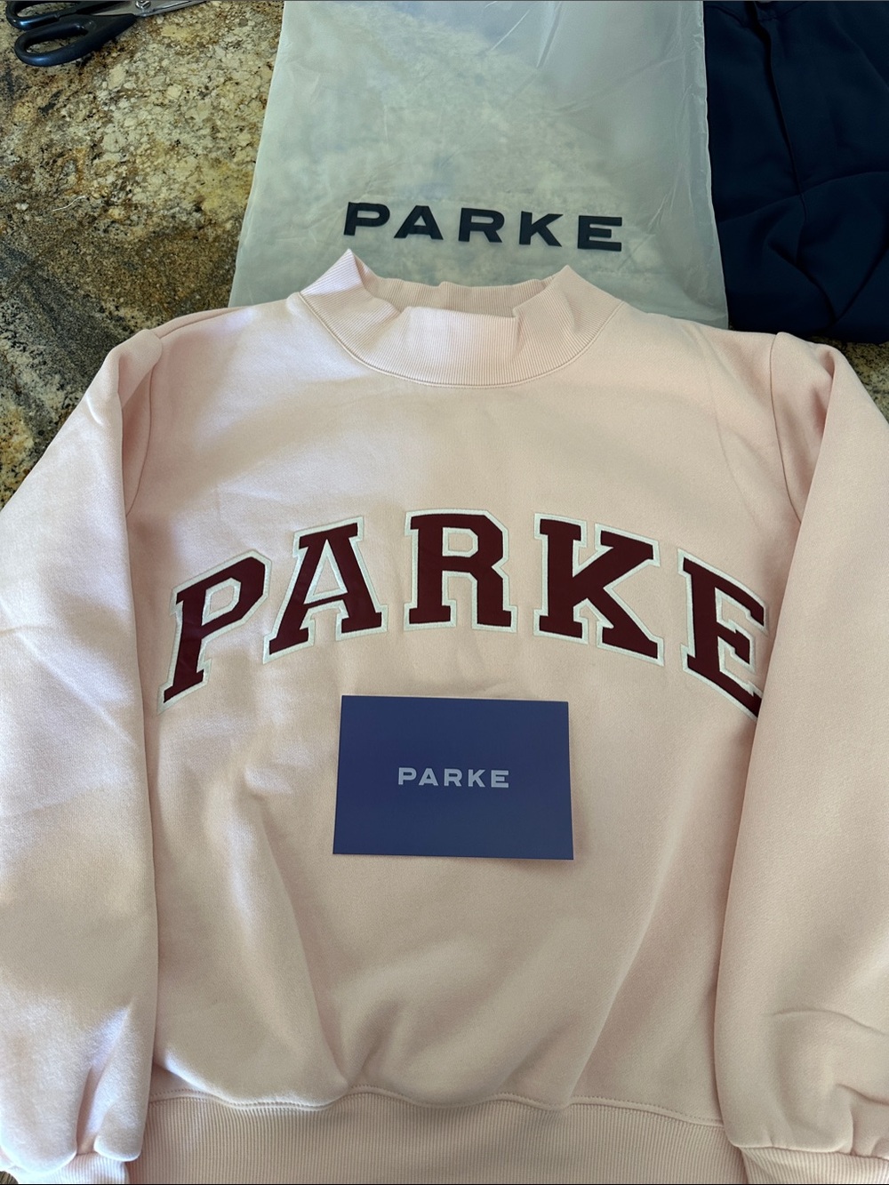 Parke Light Pink Crewneck Sweatshirt with Maroon Collegiate Letters